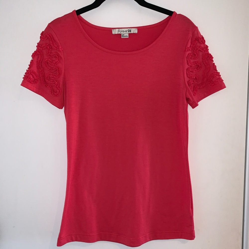 Never worn! Coral top with design on sleeves